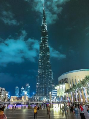 People Standing Near High-rise Building during Night Time